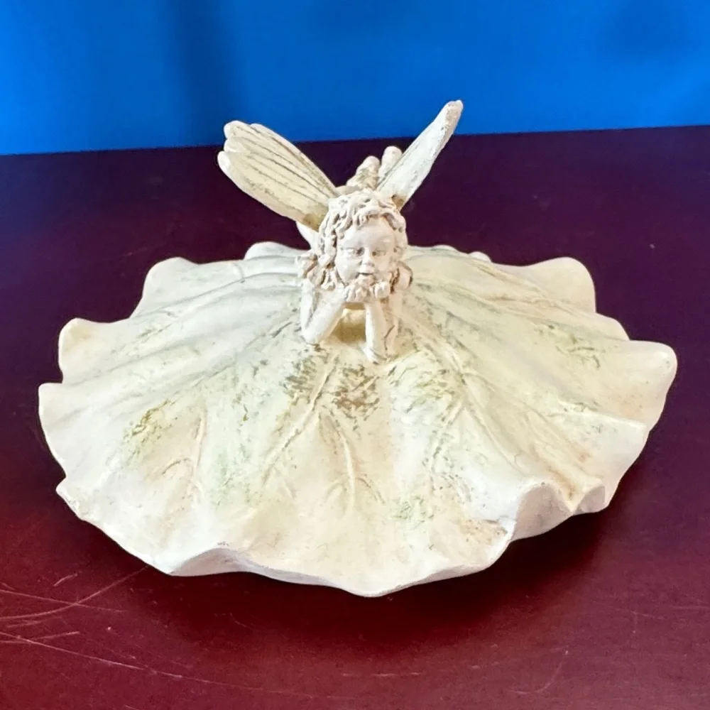 Vintage 1980 Avon Lily Fairy Daydreaming trinket or keepsake box.